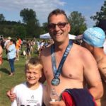 Doug after last year’s 5K open-water swim, with his son Jackson